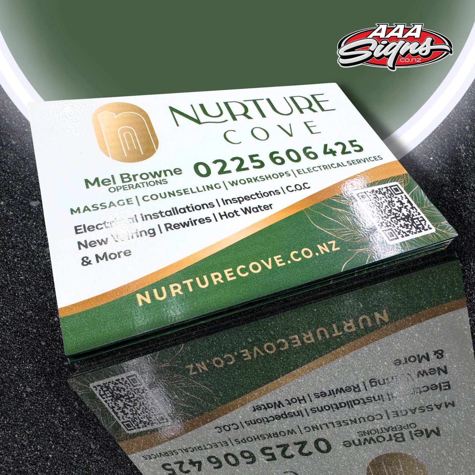 Nurture Cove gold-foil business cards printed by AAA Signs